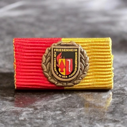 Bandschnalle mit Unterteil, individuell gestaltete Auflage